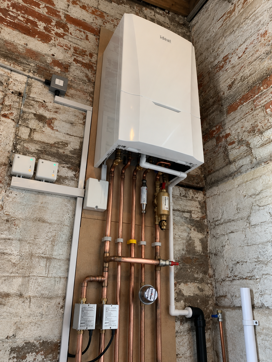 Wall-mounted boiler with neatly arranged copper pipework